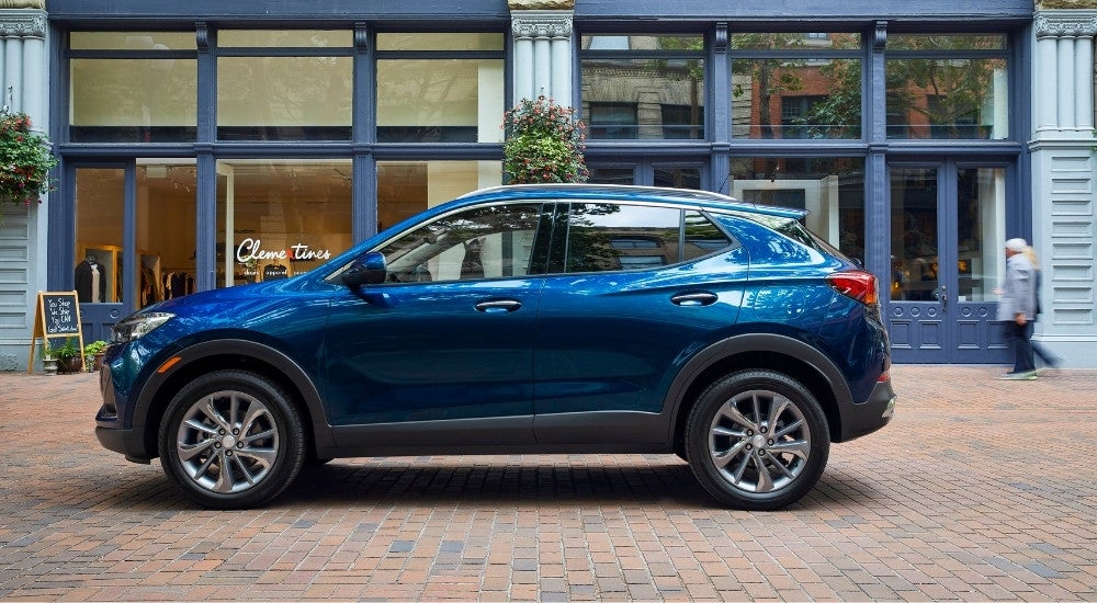 Blue 2022 Buick Encore GX parked near a building