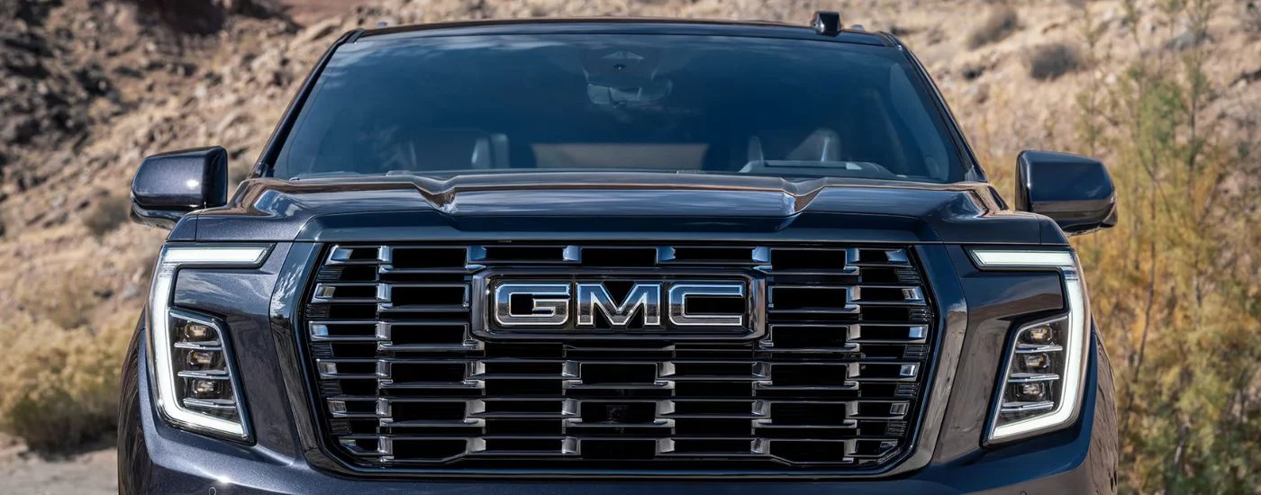 Close up of a 2026 Black GMC Yukon front end.