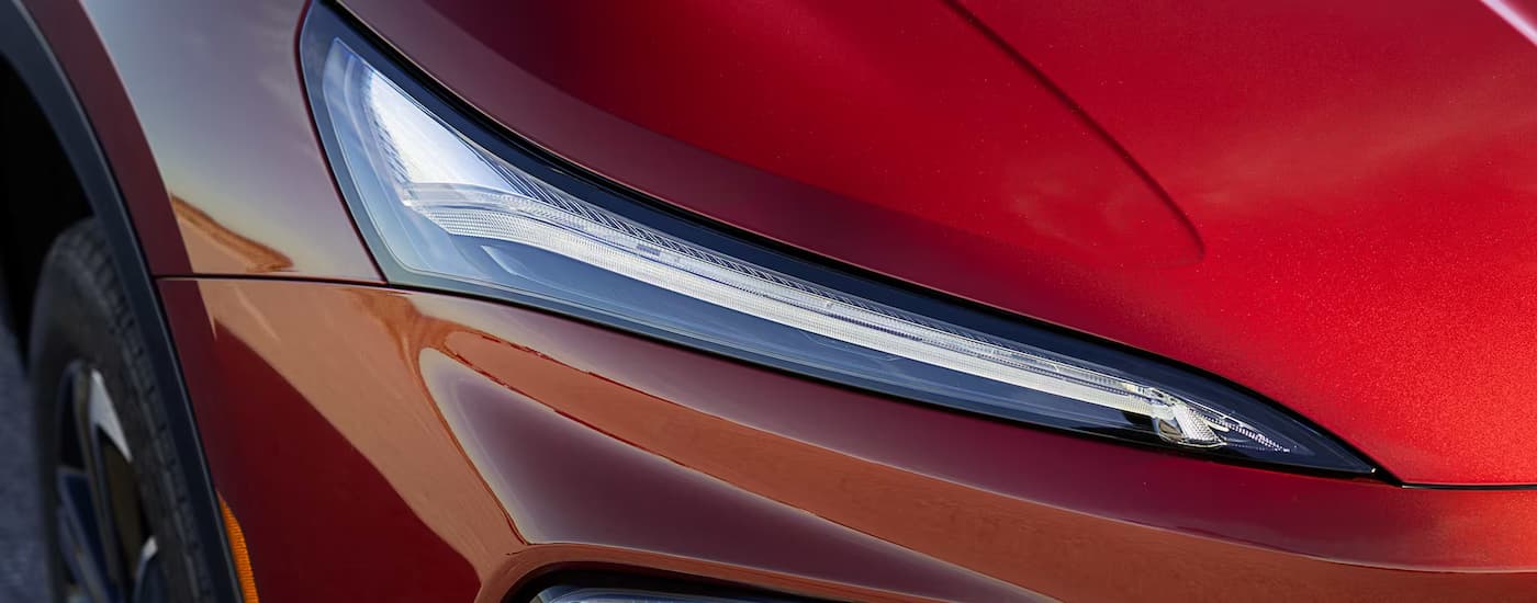 Headlight on a red 2026 Buick Enclave