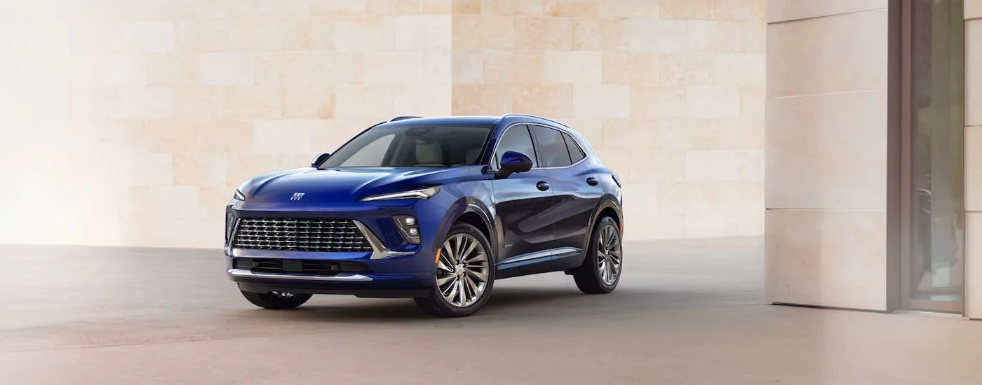 Blue 2026 Buick Envision parked next to a marble wall