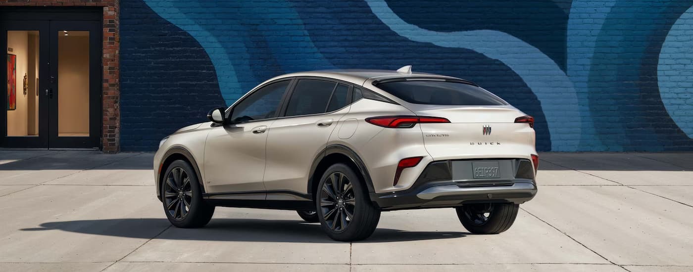 Silver 2026 Buick Envista parked near a blue brick wall mural
