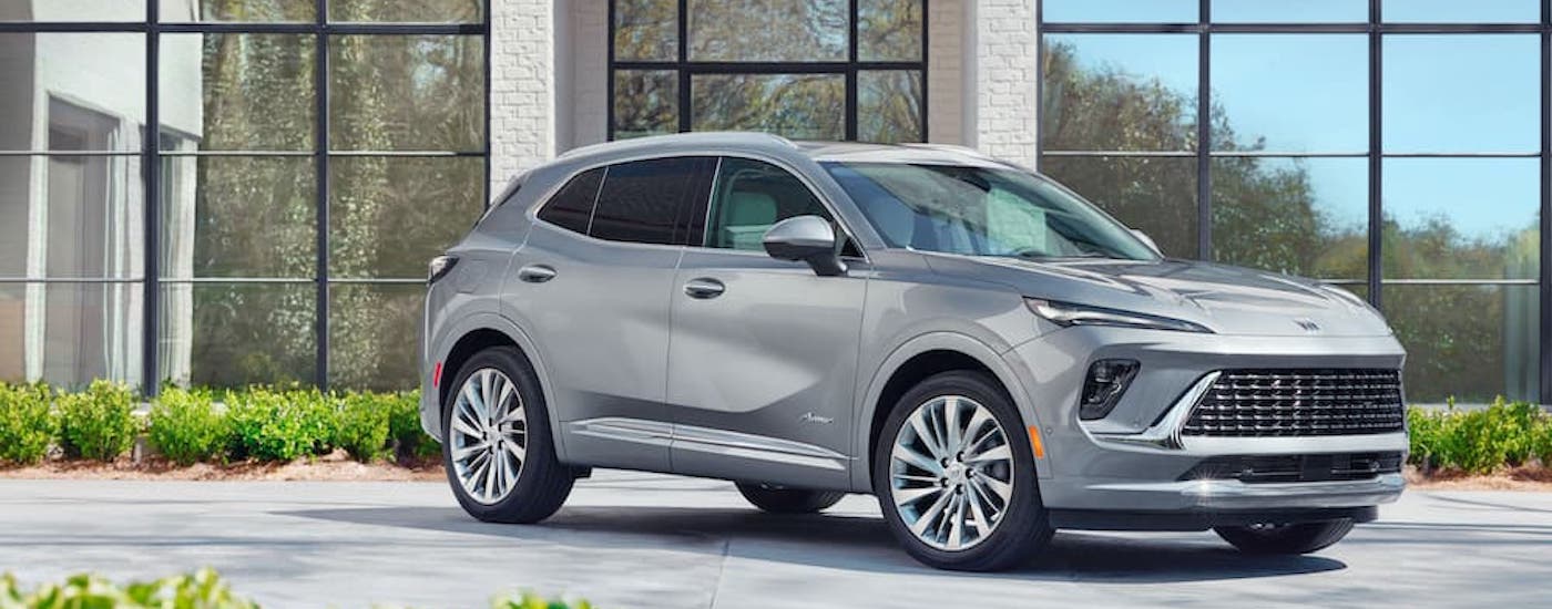 A silver 2024 Buick Envision from the side after leaving a dealer with a used Buick for sale.